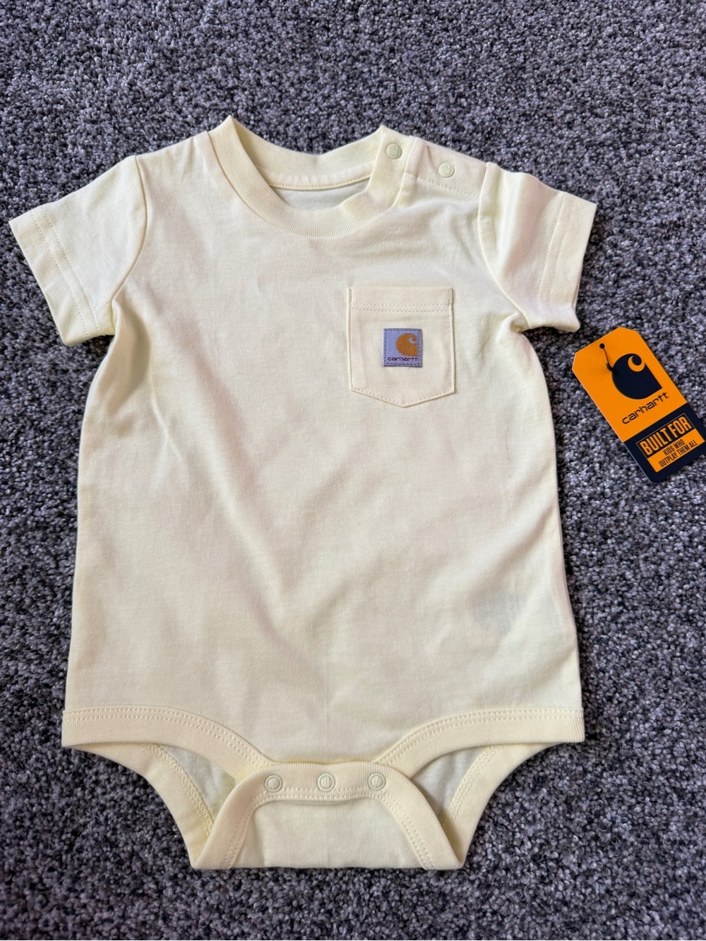 Carhartt baby bodysuit in light yellow, size 6M (small mark- see pic)